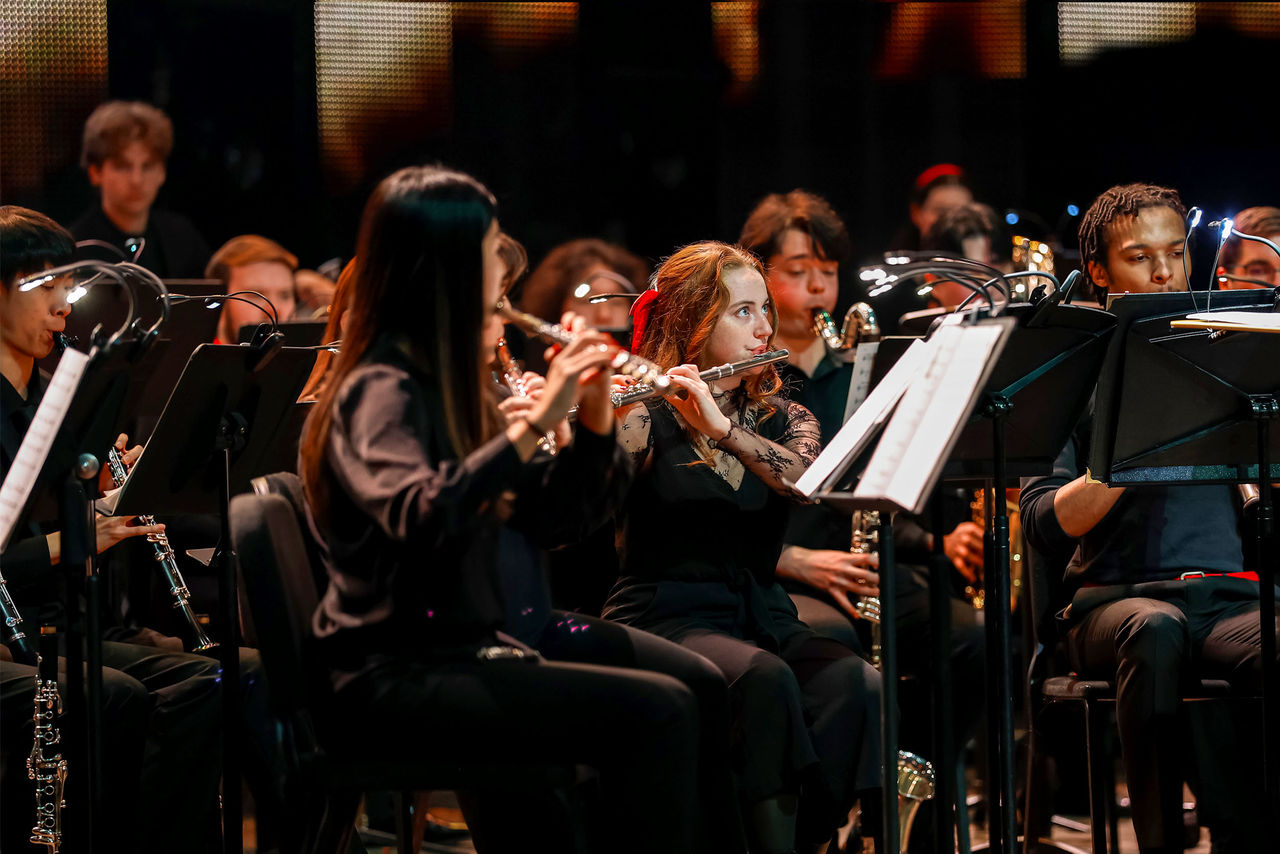 Wind Ensemble students perform on the Corbett Auditorium stage at the annual Moveable Feast event.