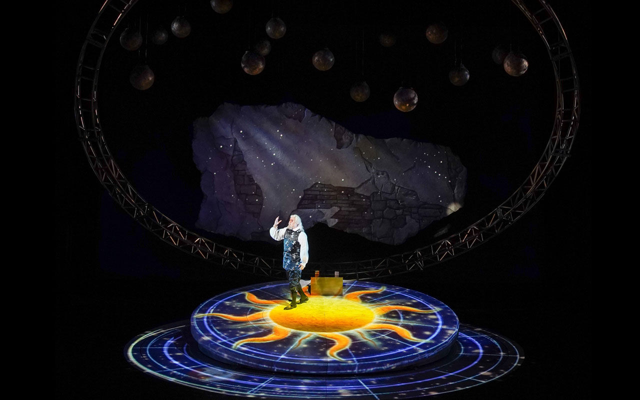 CCM Opera student sings on circular stage during performance of Galileo Galilei
