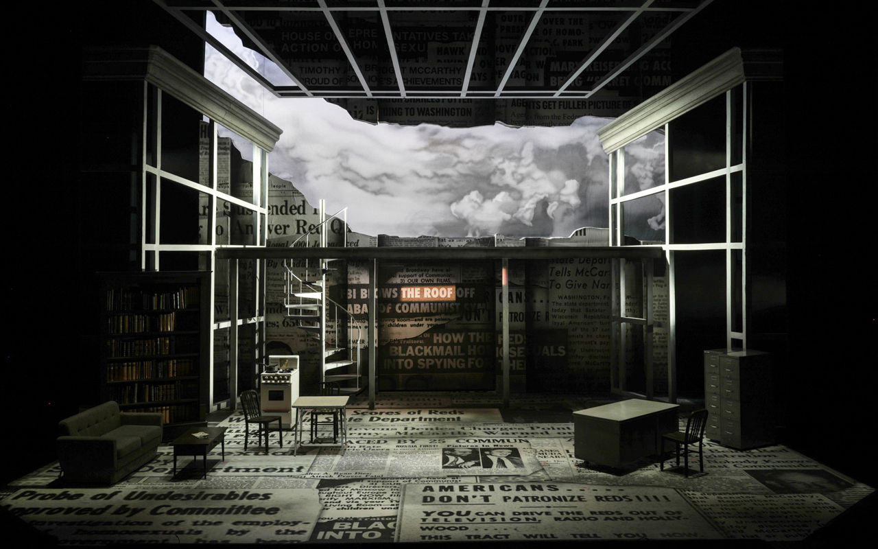 Scenic design of Fellow Travelers including clouds and newsprint on the Corbett Auditorium stage.