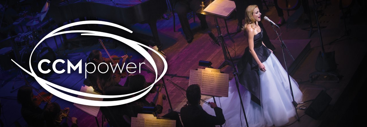 Vocal performer sings at a microphone